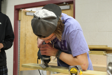 student sawing