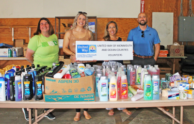 volunteers with basic needs donations