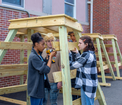 students working on lifeguard stand