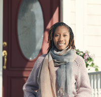 woman in front of home