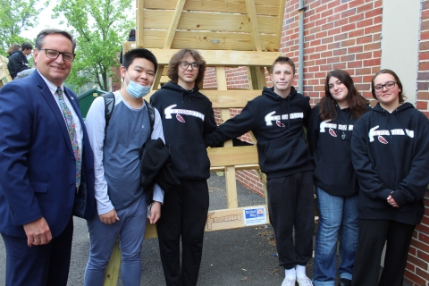 students and uwmoc representative tom hayes with lifeguard stand